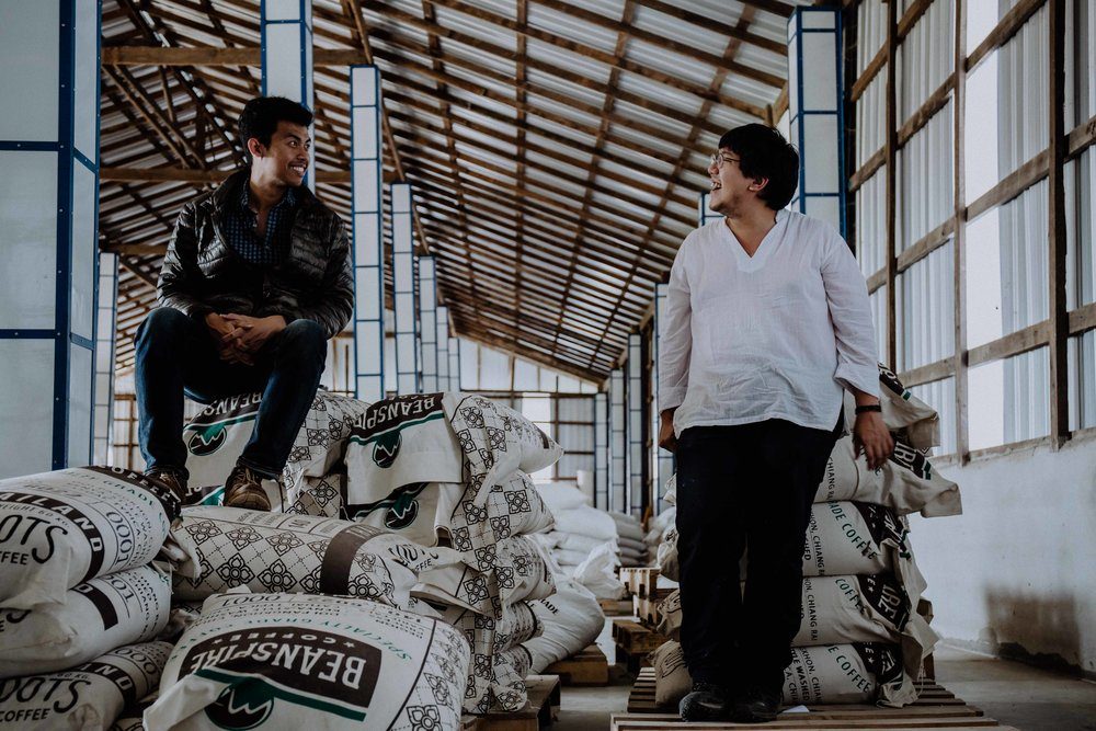 Fuadi and Korn, who is head roaster at Roots, together at the Beanspire dry mill